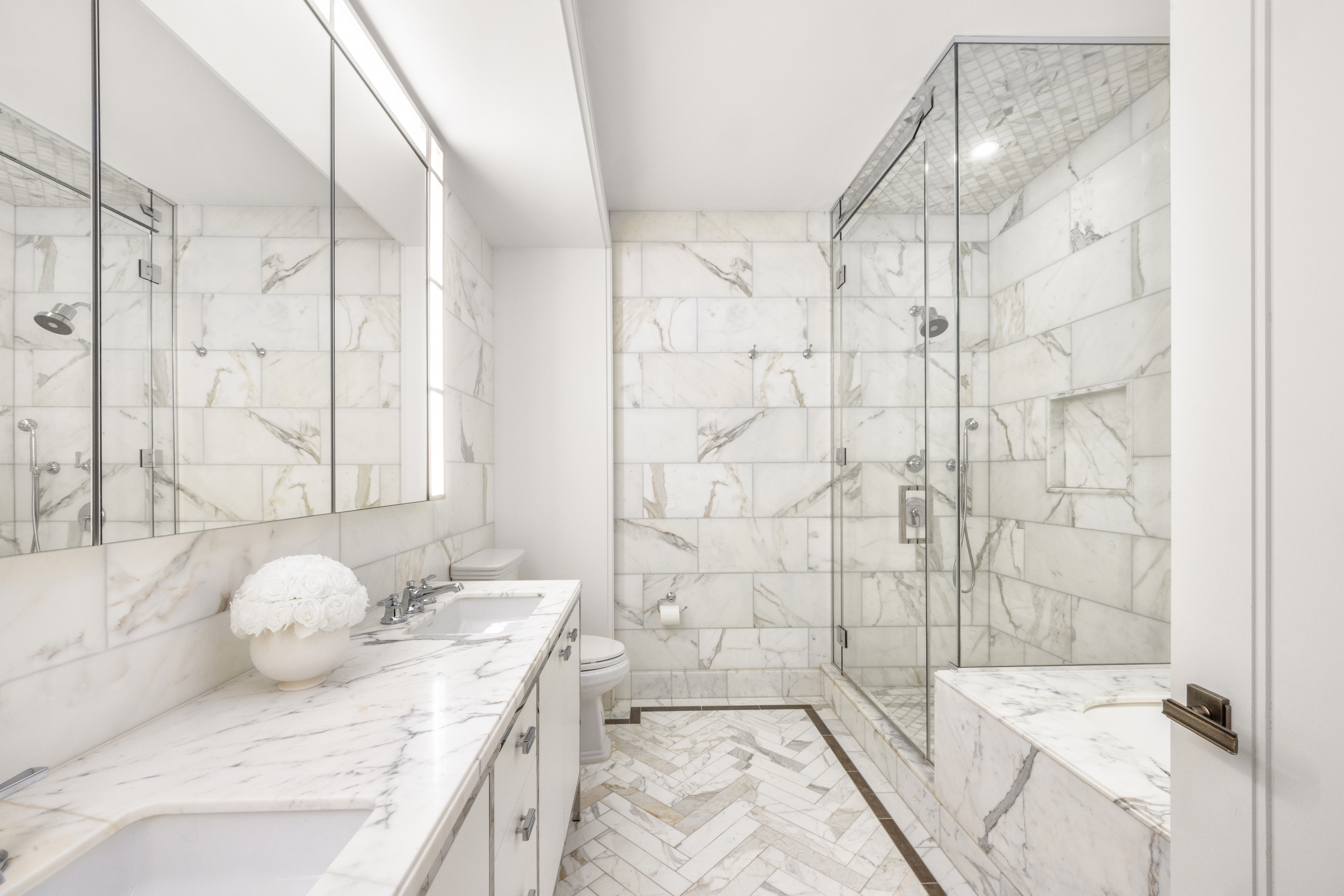 100 Barclay Street, Unit 16H Manhattan, NY 10007 - Photo 6 of 12 a bathroom with a granite countertop sink a toilet and shower