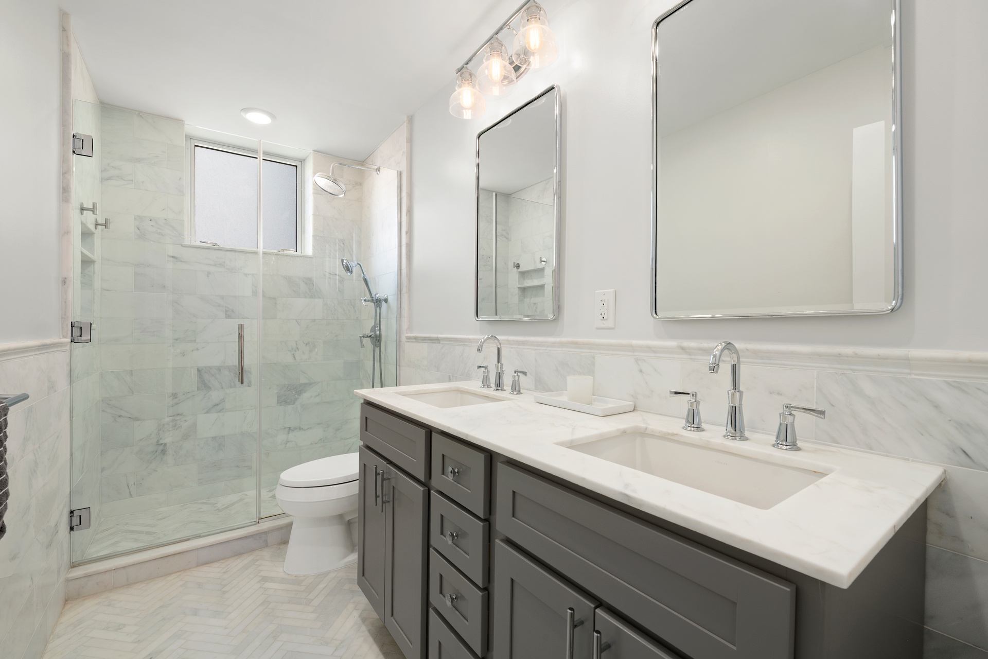 420 East 58th Street, Unit 14B Manhattan, NY 10022 - Photo 8 of 10 a bathroom with a sink a toilet and shower