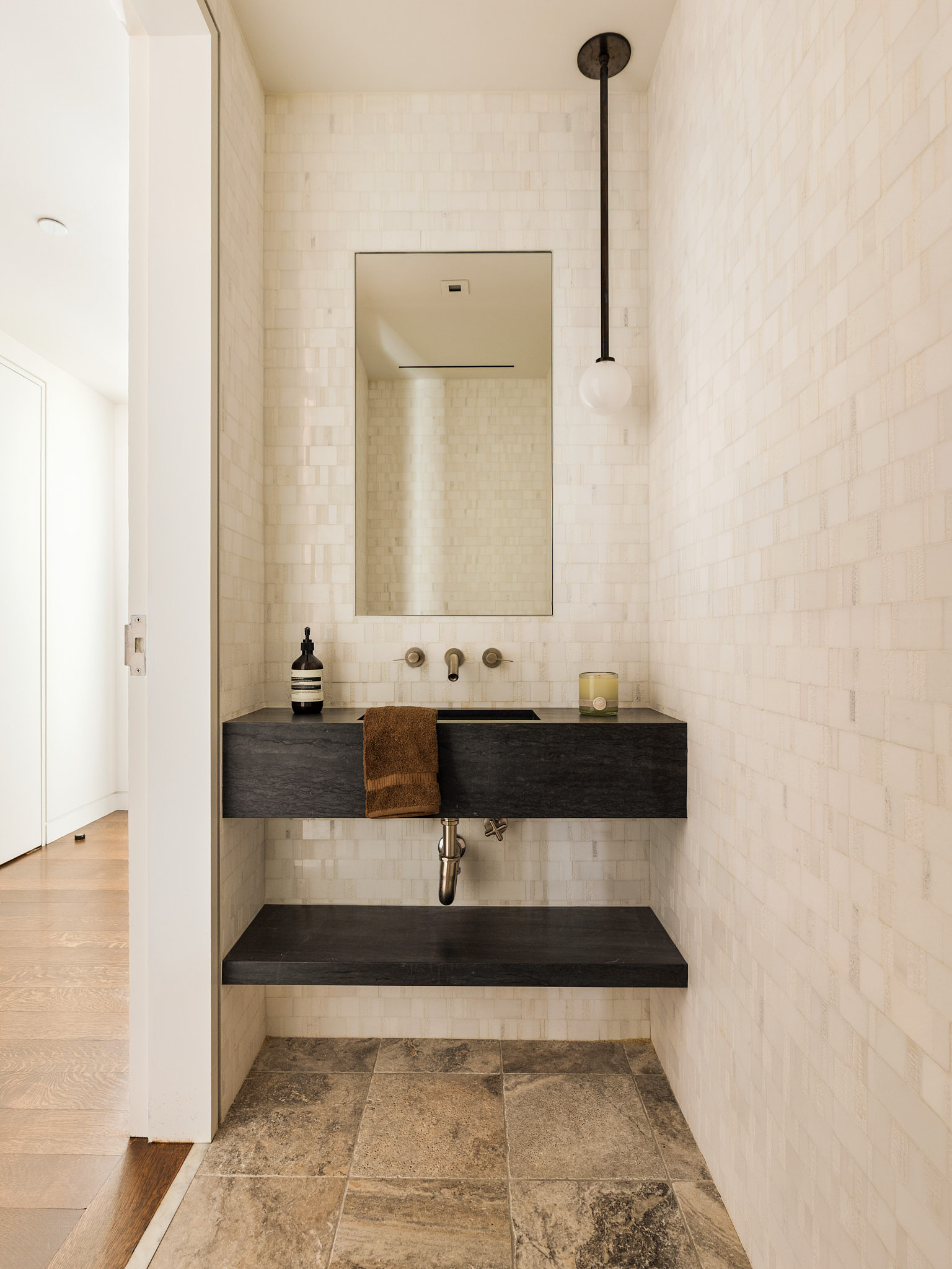 34 Prince Street, Unit 3B Manhattan, NY 10012 - Photo 13 of 18 a bathroom with a sink and a mirror