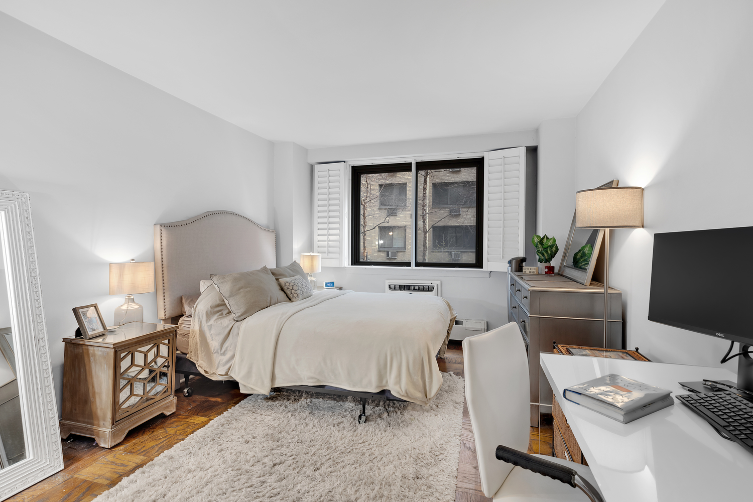 16 West 16th Street, Unit 2LN Manhattan, NY 10011 - Photo 4 of 11 a bedroom with a bed and a window