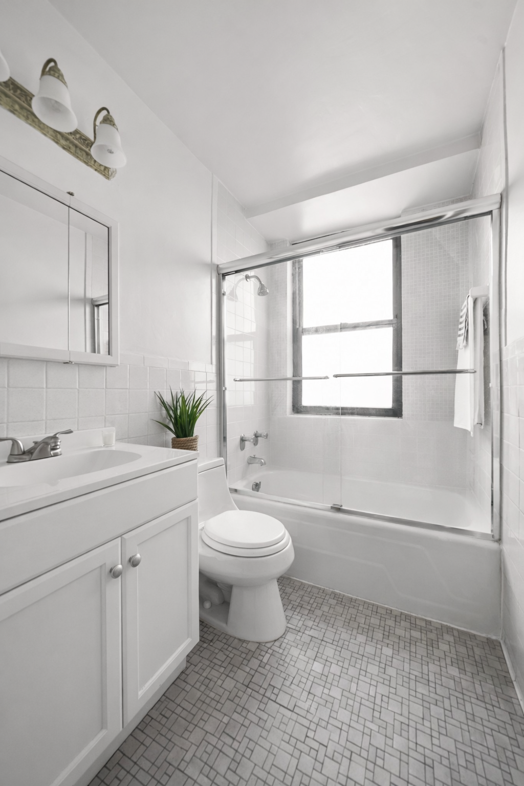 225 East 36th Street, Unit 10N Manhattan, NY 10016 - Photo 8 of 13 a bathroom with a double vanity sink toilet and a mirror