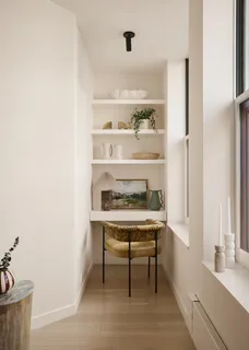 a room with a table and chairs