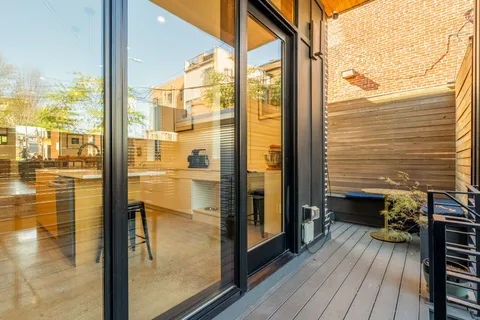 a view of a balcony from a glass door