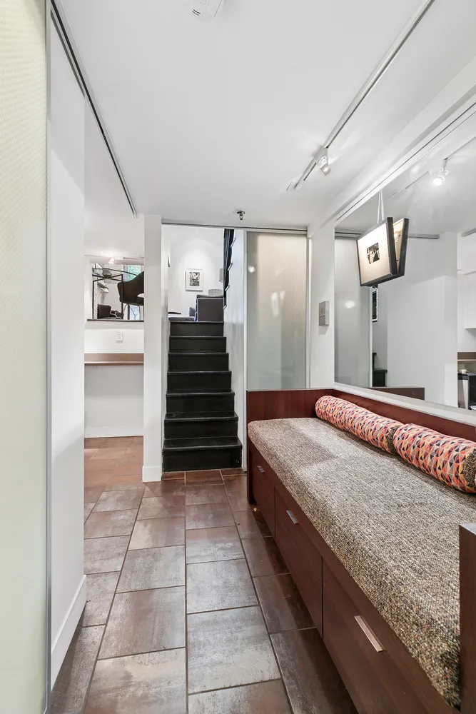 a spacious bathroom with a granite countertop sink and a mirror