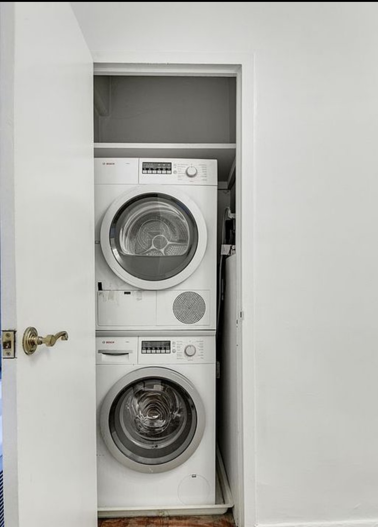 16 Sutton Place, Unit 2B Manhattan, NY 10022 - Photo 14 of 20 a utility room with dryer and washer