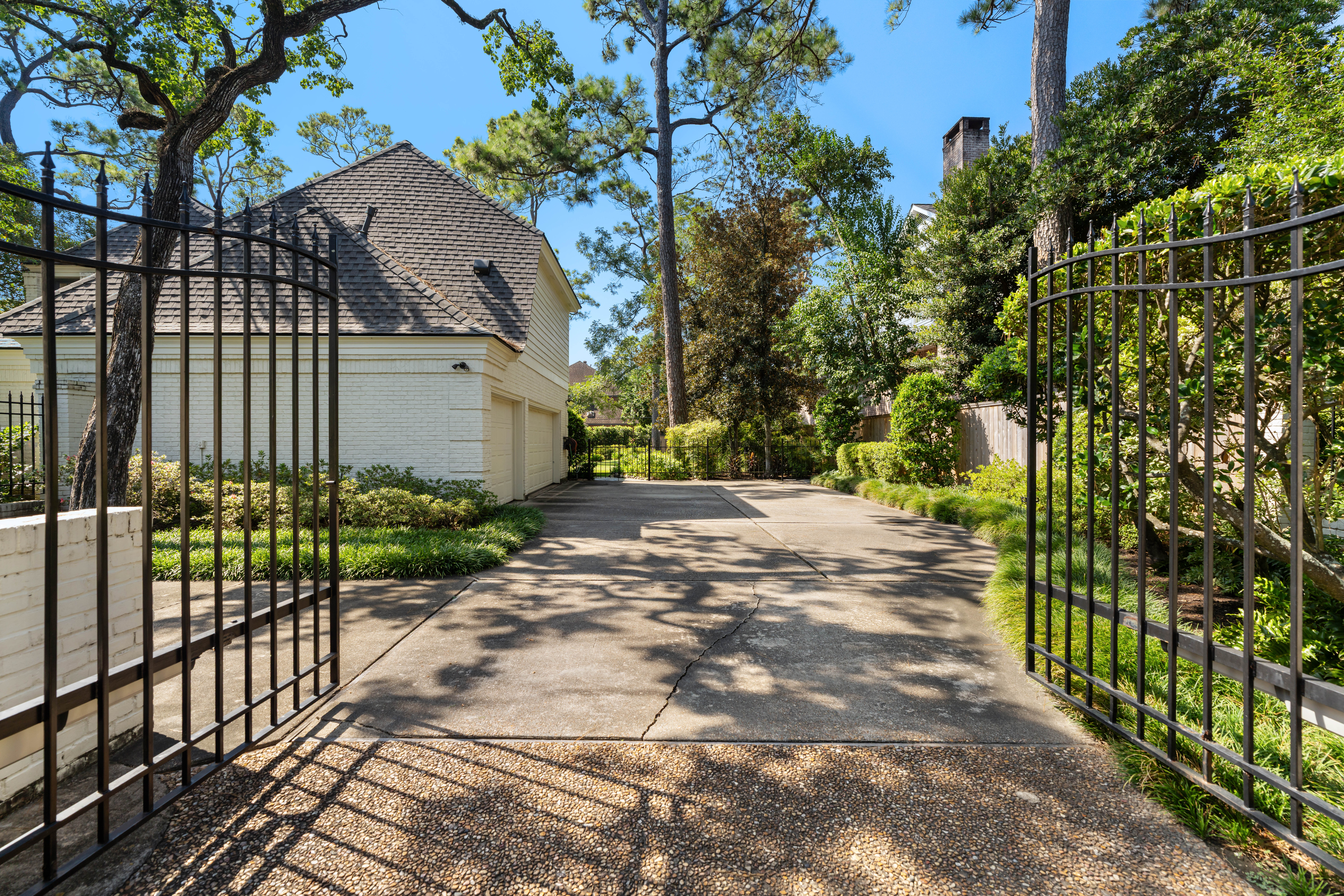 711 Pifer Road Houston, TX 77024 - Photo 52 of 53 a view of a house with a small yard and wooden fence
