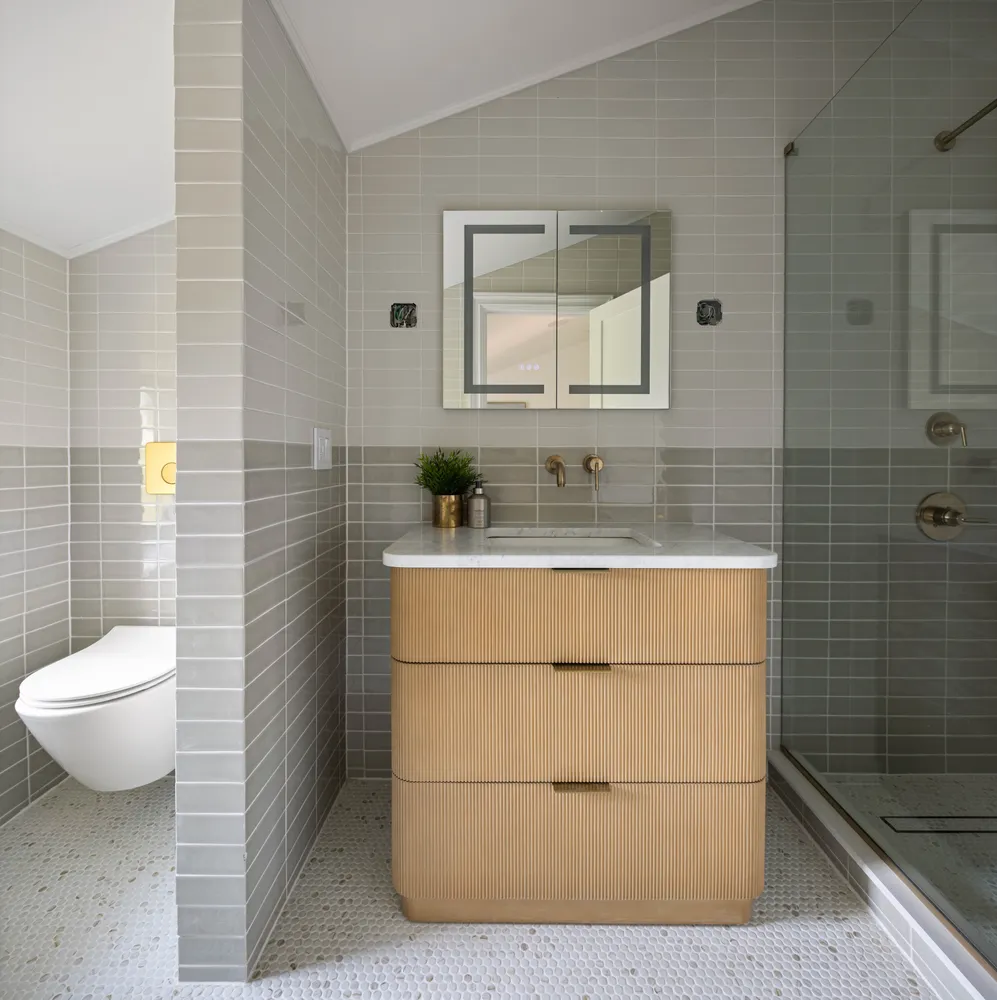 a bathroom with a sink toilet and mirror