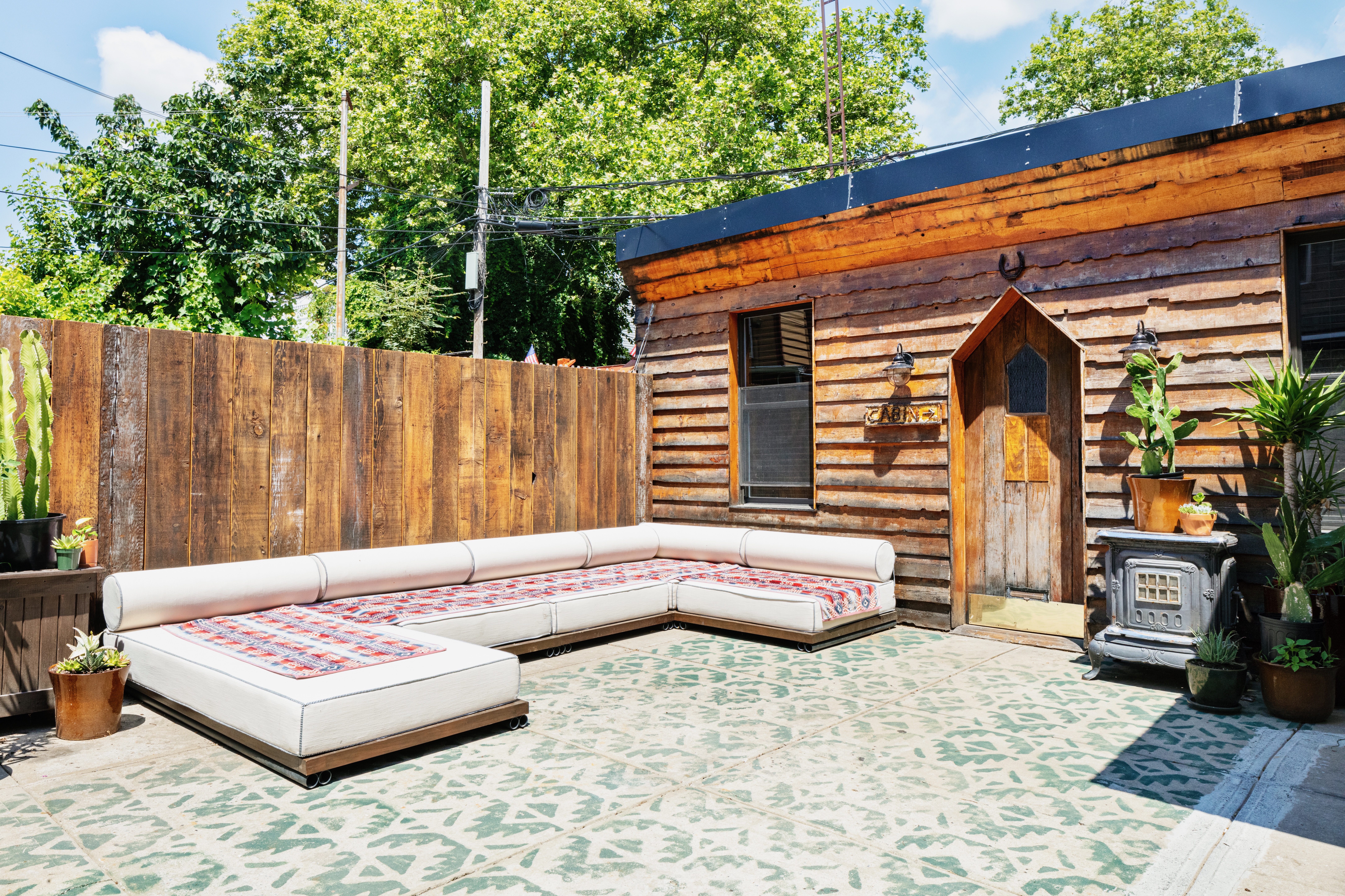 111 Powers Street Brooklyn, NY 11211 - Photo 9 of 16 a outdoor space with lots of furniture and garden view