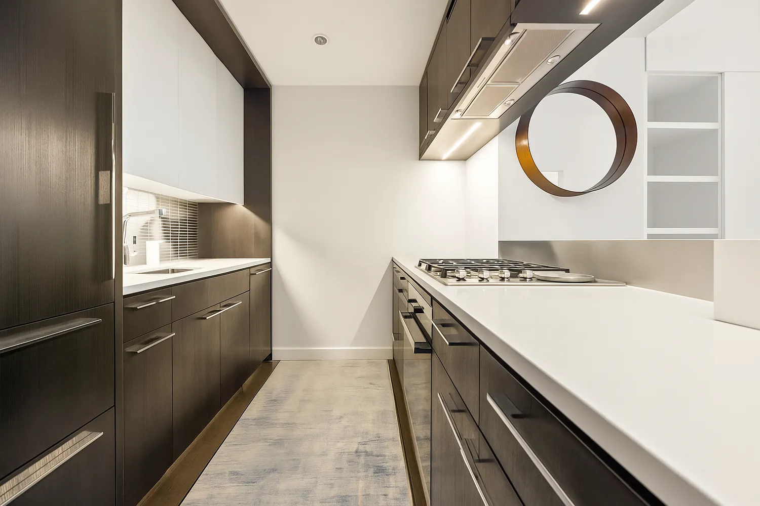 a kitchen with a sink and a stove