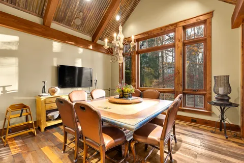 a view of a dining room with furniture window and outside view