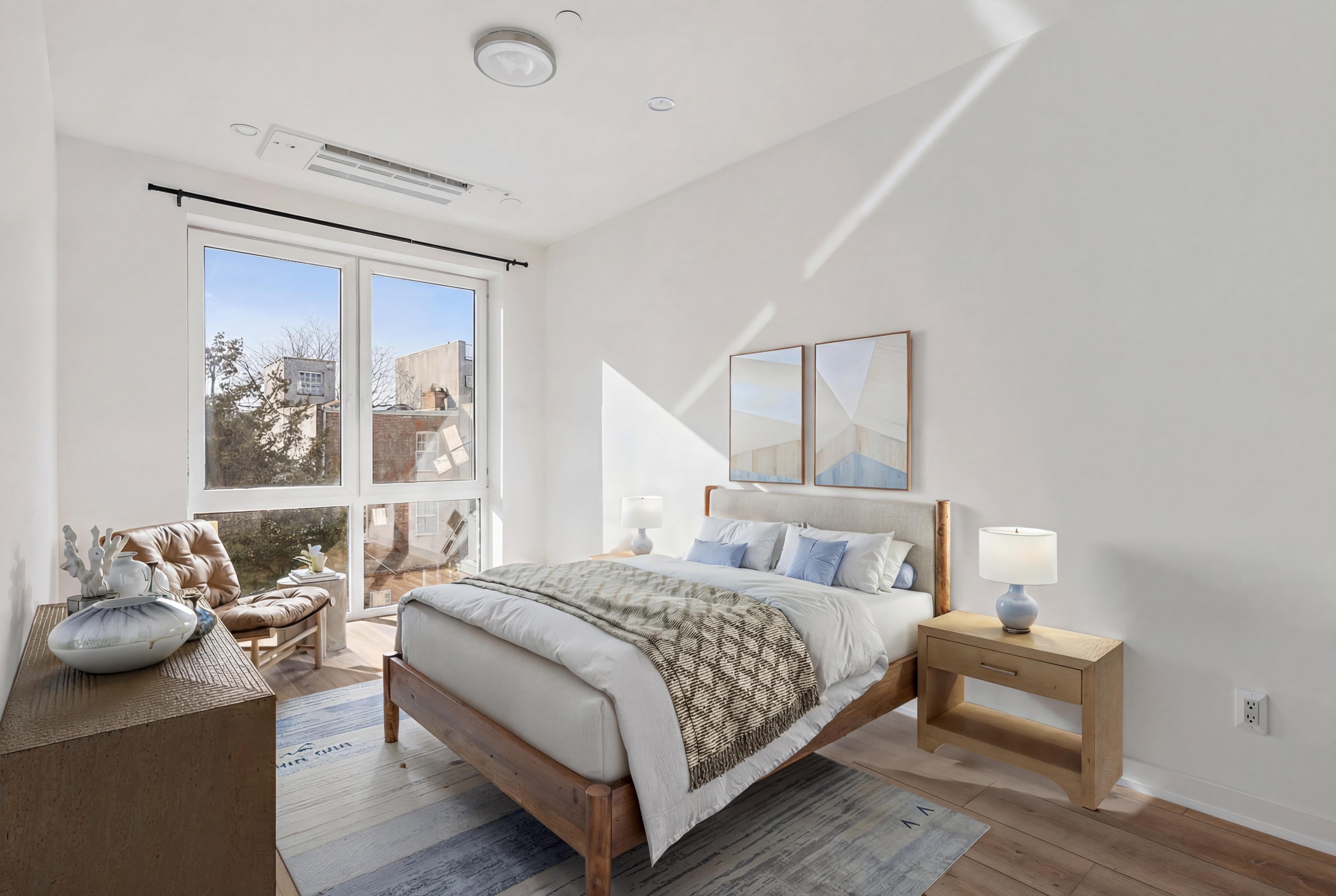 176 12th Street, Unit 2 Brooklyn, NY 11215 - Photo 5 of 10 a bedroom with a bed and wooden floor