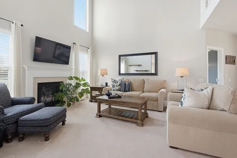 a living room with furniture fireplace and a flat screen tv