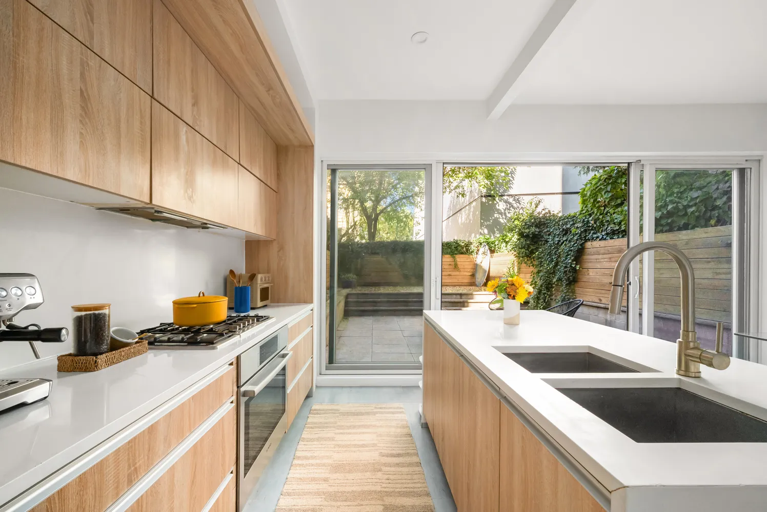 a kitchen that has a sink and a stove