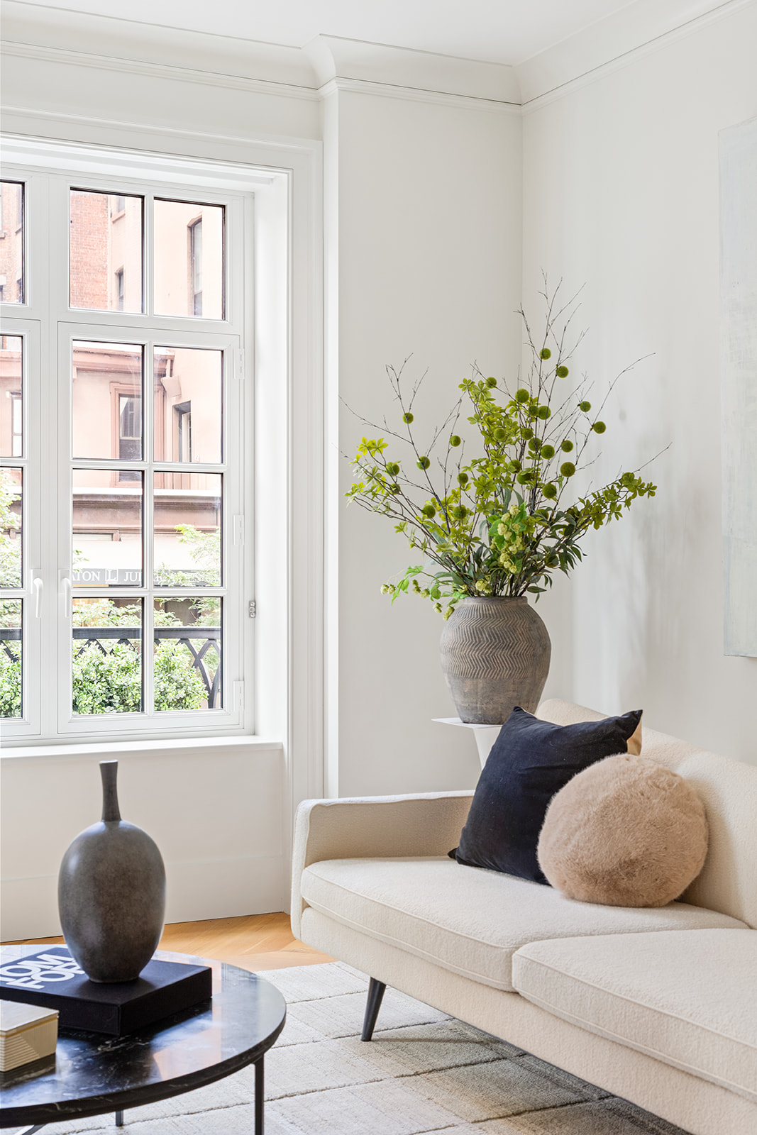 1045 Madison Avenue, Unit 3B Manhattan, NY 10075 - Photo 4 of 14 a living room with furniture and a potted plant