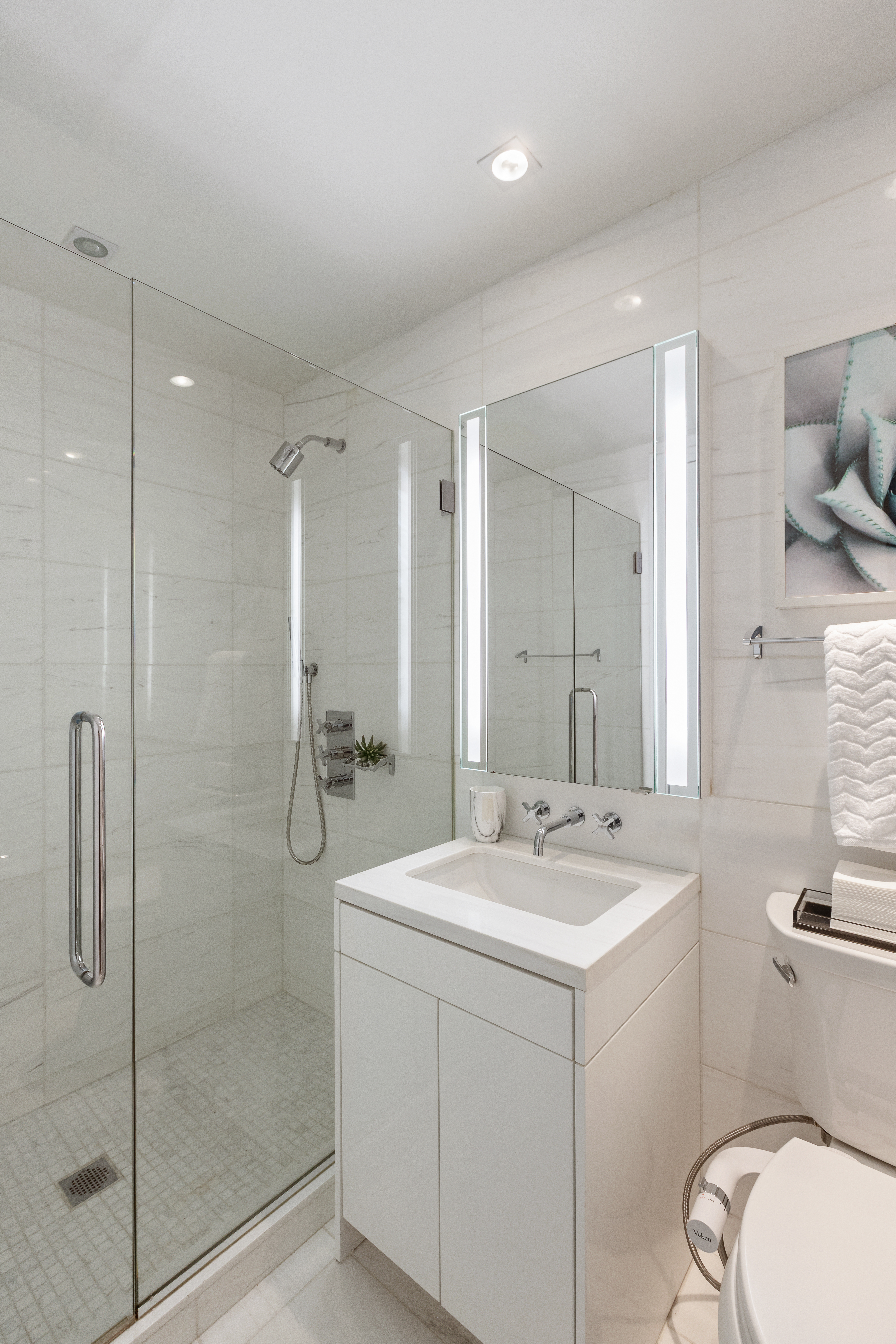 1355 1st Avenue, Unit 8 Manhattan, NY 10021 - Photo 23 of 25 a bathroom with a sink a toilet and shower