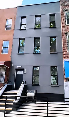 30 Marconi Place, Unit 2 Brooklyn, NY 11233 - Photo 11 of 11 a front view of a building with many windows
