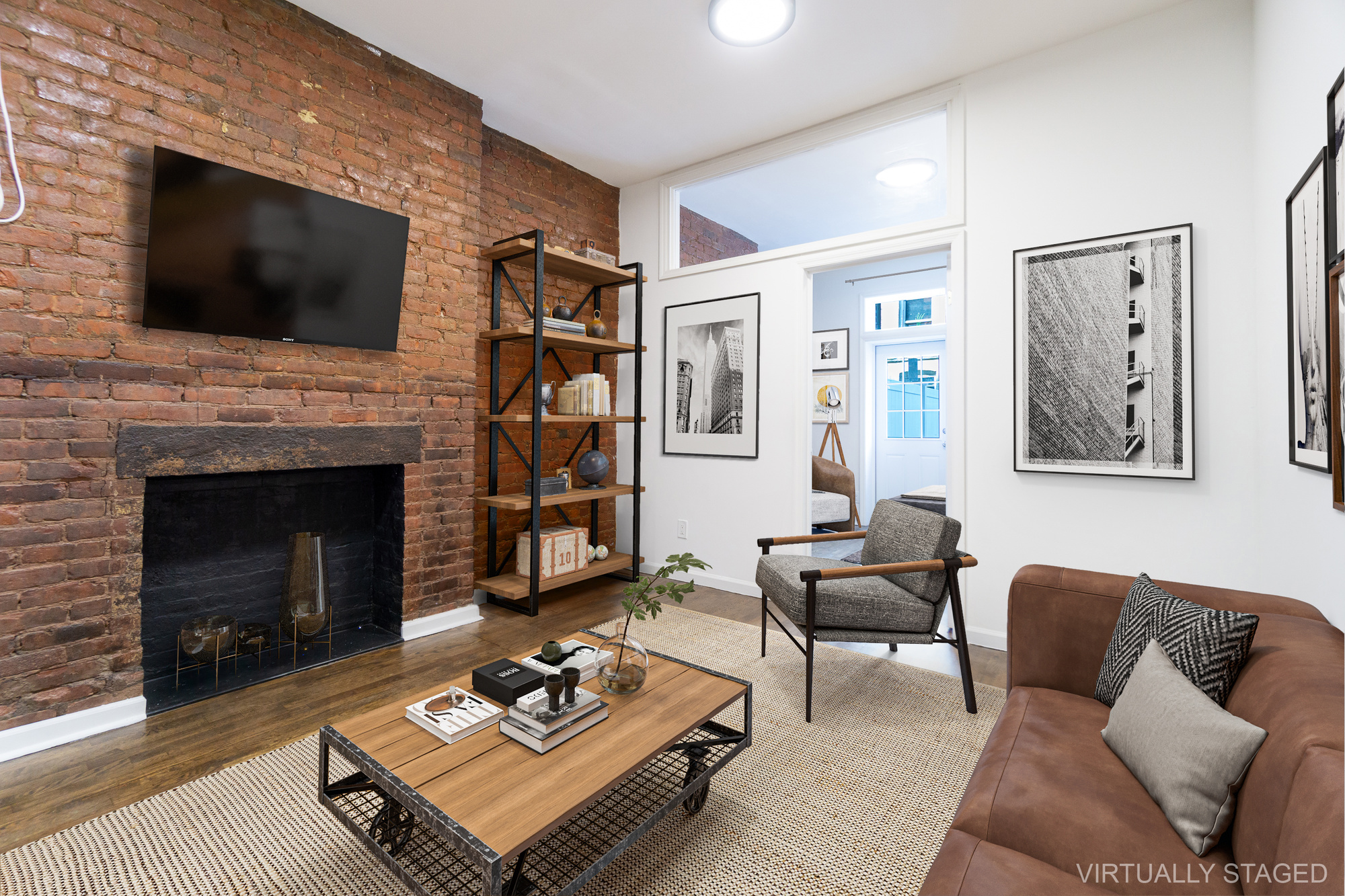 339 East 6th Street, Unit B Manhattan, NY 10003 - Photo 9 of 22 a living room with furniture a flat screen tv and a fireplace