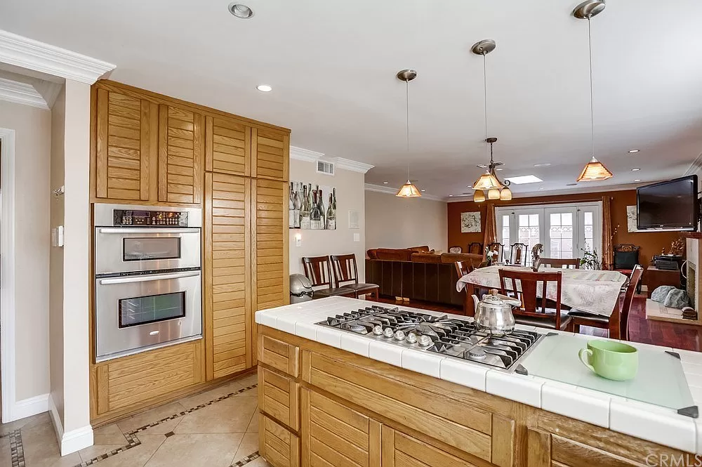 15604 Deblynn Avenue Gardena, CA 90248 - Photo 4 of 22 a kitchen with a stove a refrigerator and a sink