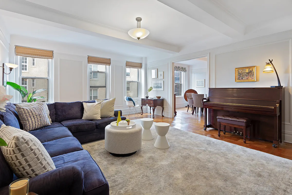 415 Central Park West, Unit 6A Manhattan, NY 10025 - Photo 6 of 25 a living room with furniture and a fireplace
