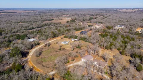 a view of a multi story building with a yard