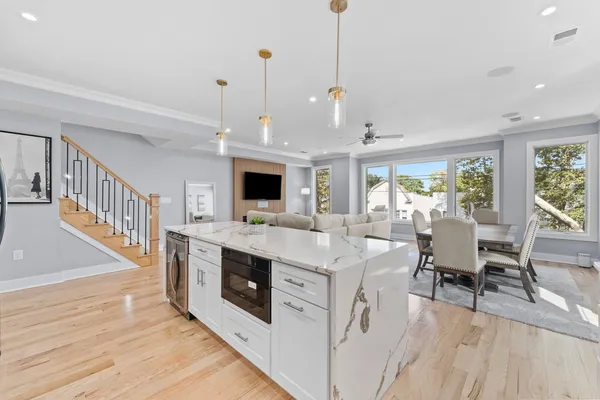 a view of living room with furniture and flat screen tv