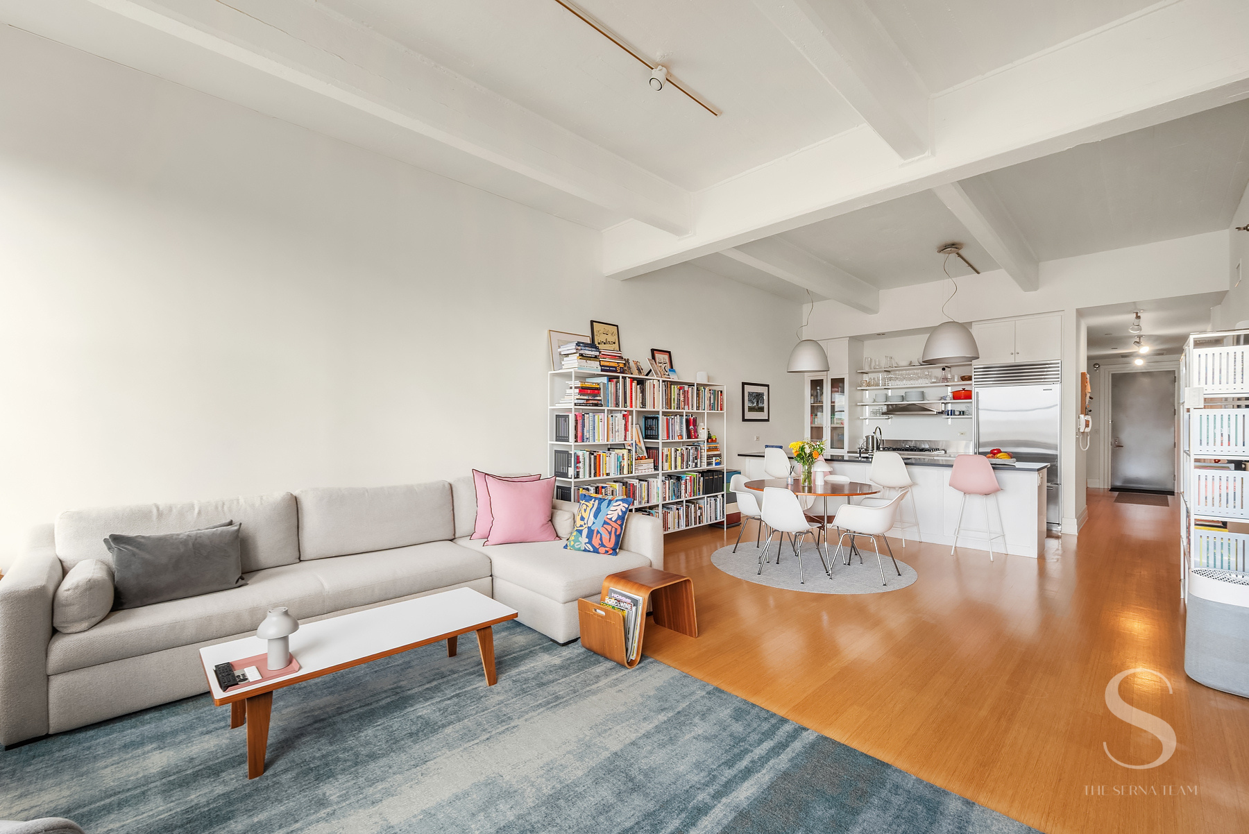 70 Washington Street, Unit 8H Brooklyn, NY 11201 - Photo 2 of 15 a living room with lots of furniture and a view of kitchen