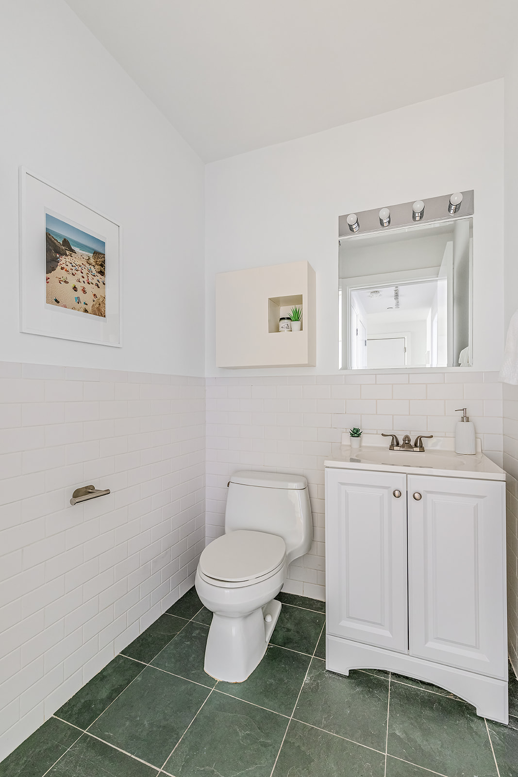 372 15th Street, Unit 2A Brooklyn, NY 11215 - Photo 7 of 10 a bathroom with a toilet sink and mirror