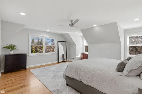 a bedroom with a bed and a dresser