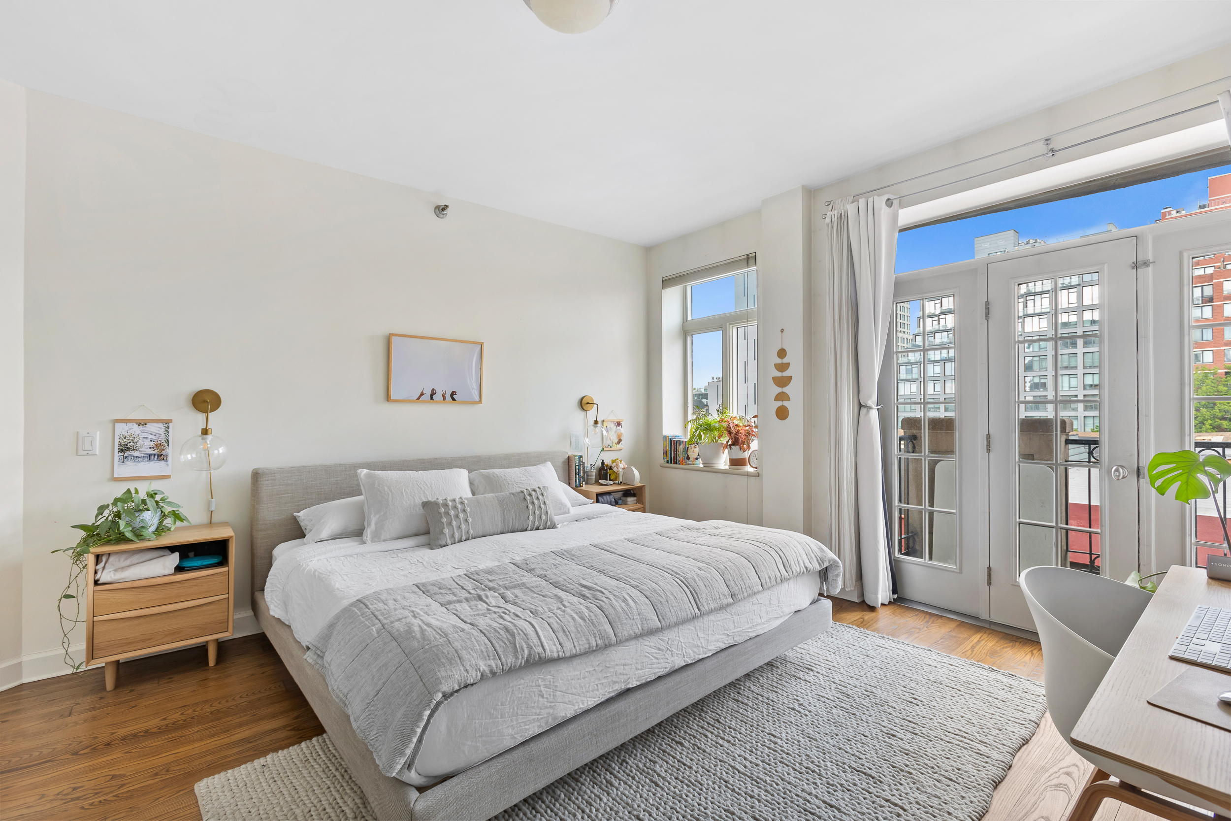 310 2nd Street, Unit 3C Brooklyn, NY 11215 - Photo 7 of 14 a bedroom with a bed and wooden floor