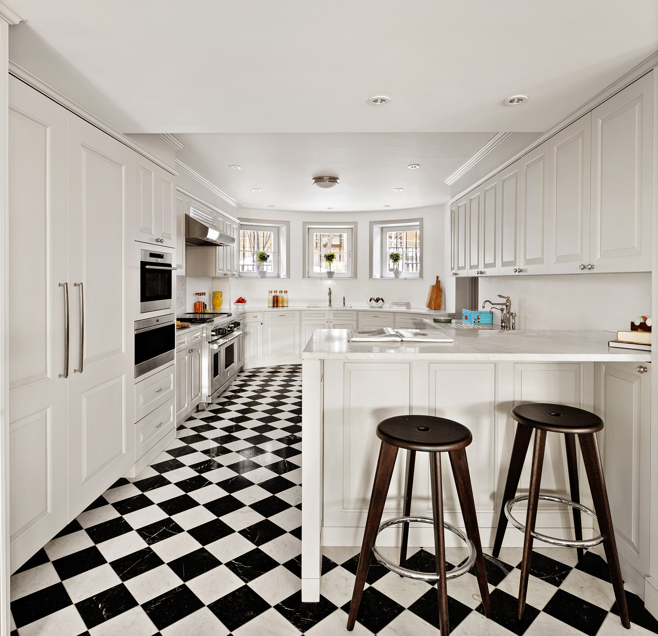 400 West 12th Street, Unit TH3 Manhattan, NY 10014 - Photo 10 of 29 a kitchen with stainless steel appliances kitchen island granite countertop a sink and cabinets