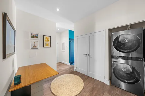 a view of a livingroom with furniture and a mirror