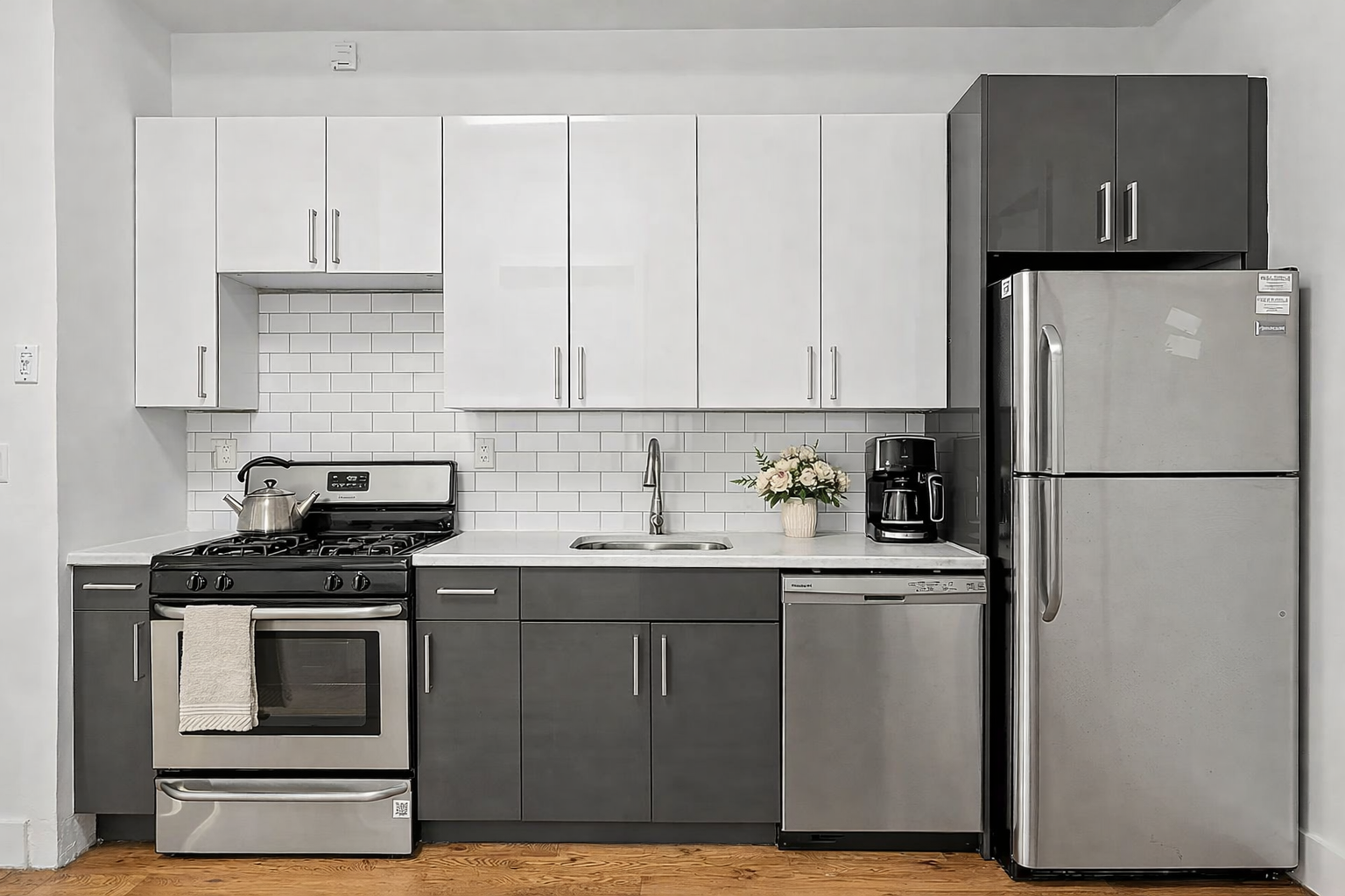 108 Eldert Street, Unit 2F Brooklyn, NY 11207 - Photo 2 of 8 a kitchen with a sink stove and refrigerator
