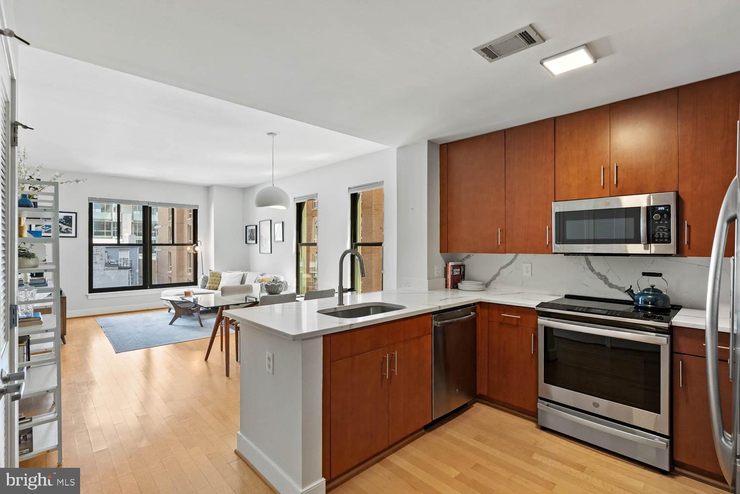 910 M Street Northwest, Unit 403 Washington, DC 20001 - Photo 8 of 31 a kitchen with a sink stove and microwave