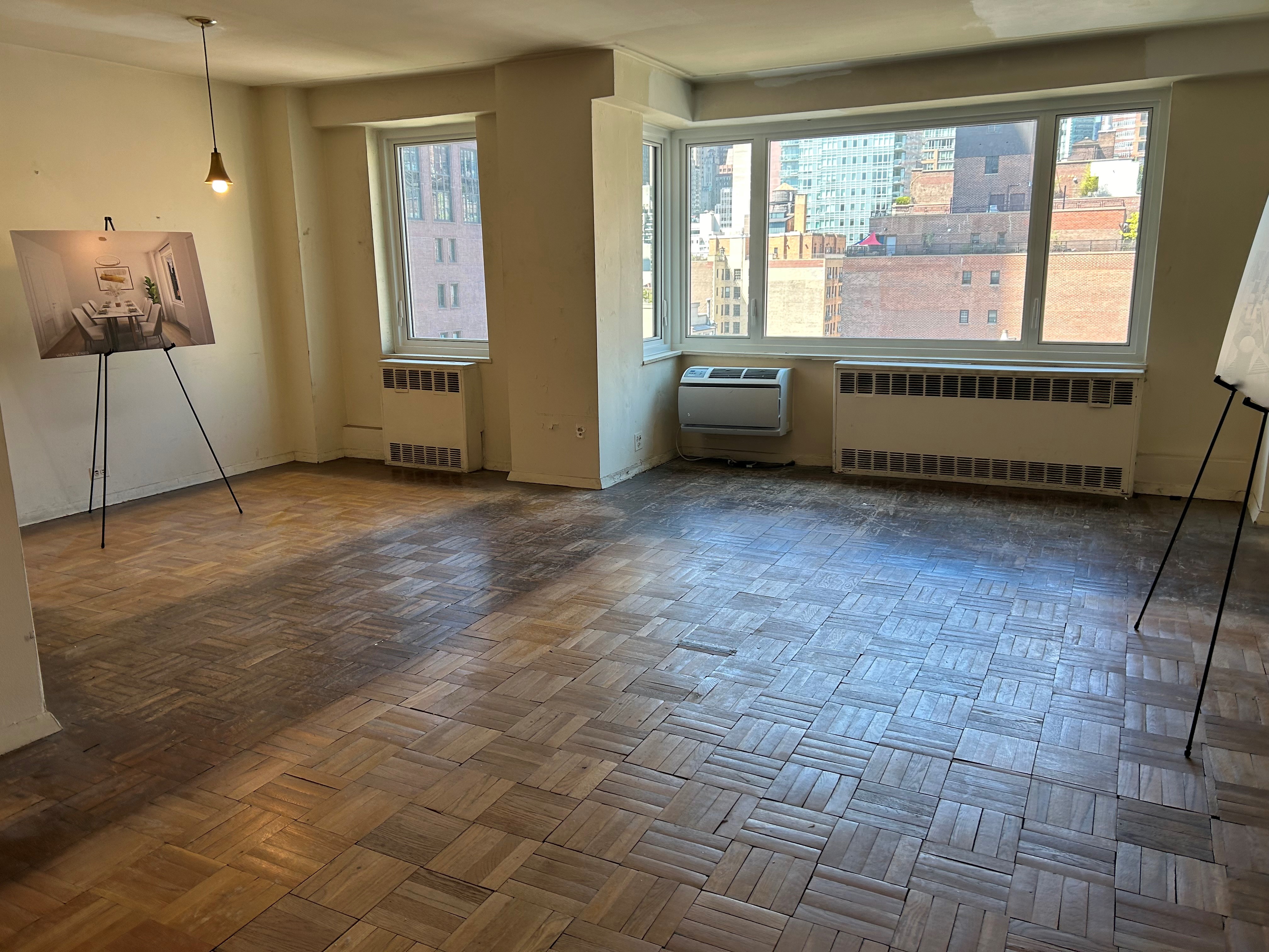 411 East 53rd Street, Unit 11K Manhattan, NY 10022 - Photo 11 of 19 a view of an empty room with a window