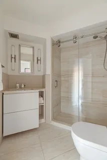 a bathroom with a bathtub and a sink