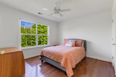 a bedroom with a bed and window