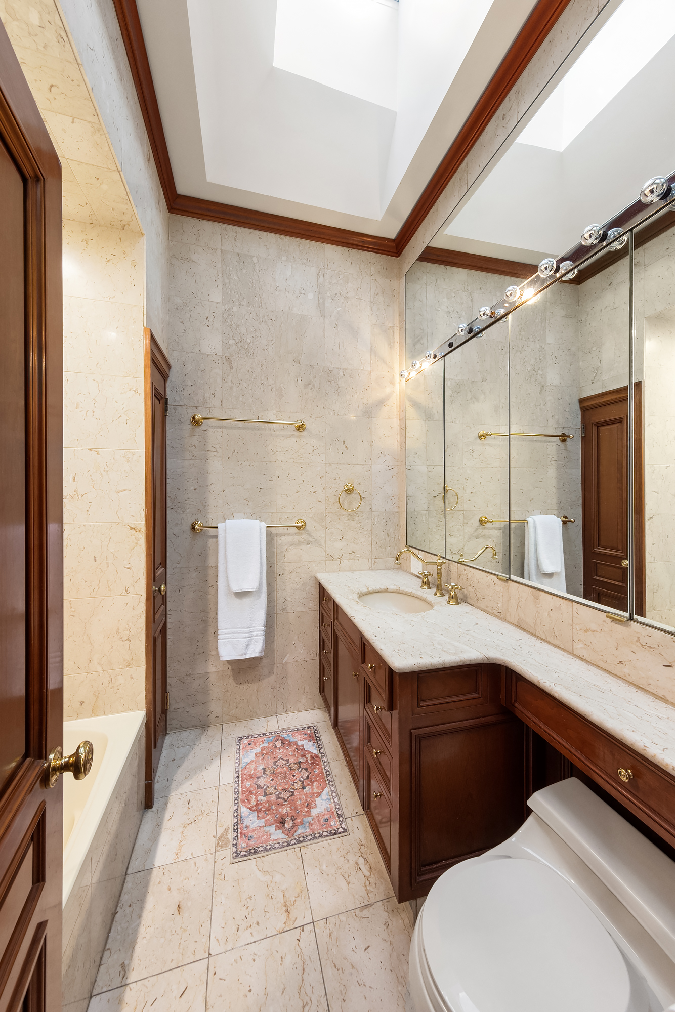 159 West 13th Street Manhattan, NY 10011 - Photo 35 of 36 a bathroom with a sink a toilet a mirror and shower