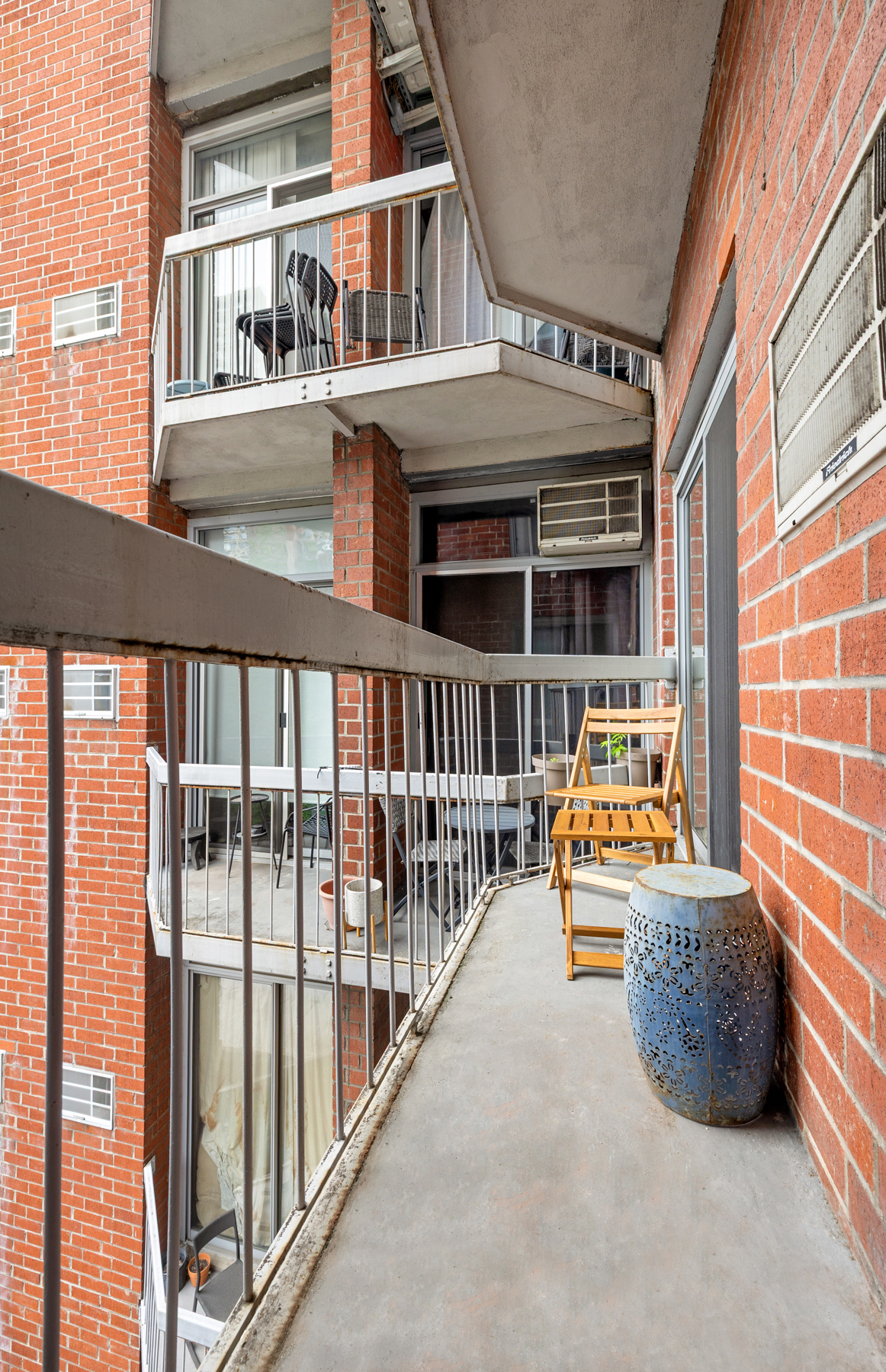 184 Thompson Street, Unit 4U Manhattan, NY 10012 - Photo 4 of 9 a view of a balcony with chairs