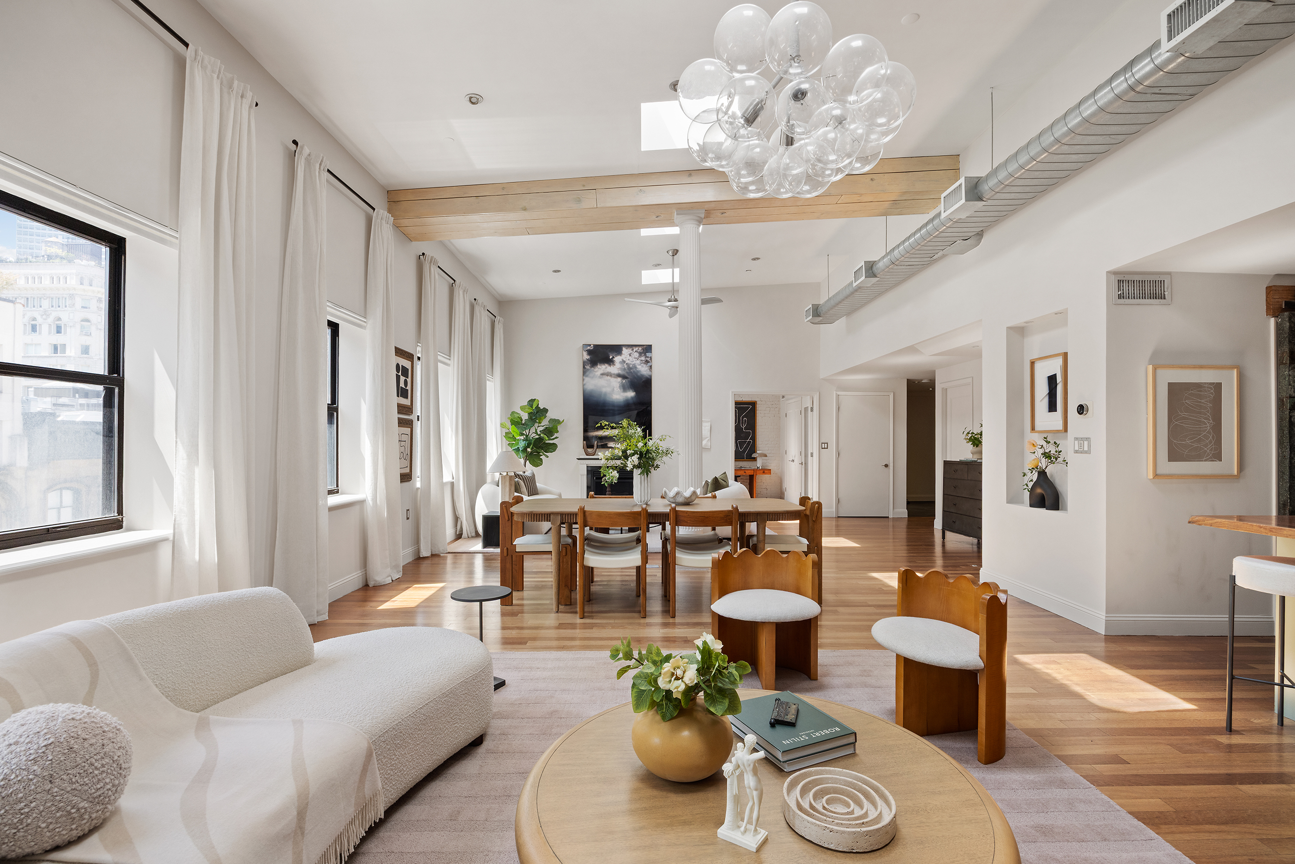 100 Reade Street, Unit 6CD Manhattan, NY 10013 - Photo 6 of 26 a living room with furniture dining table and a chandelier