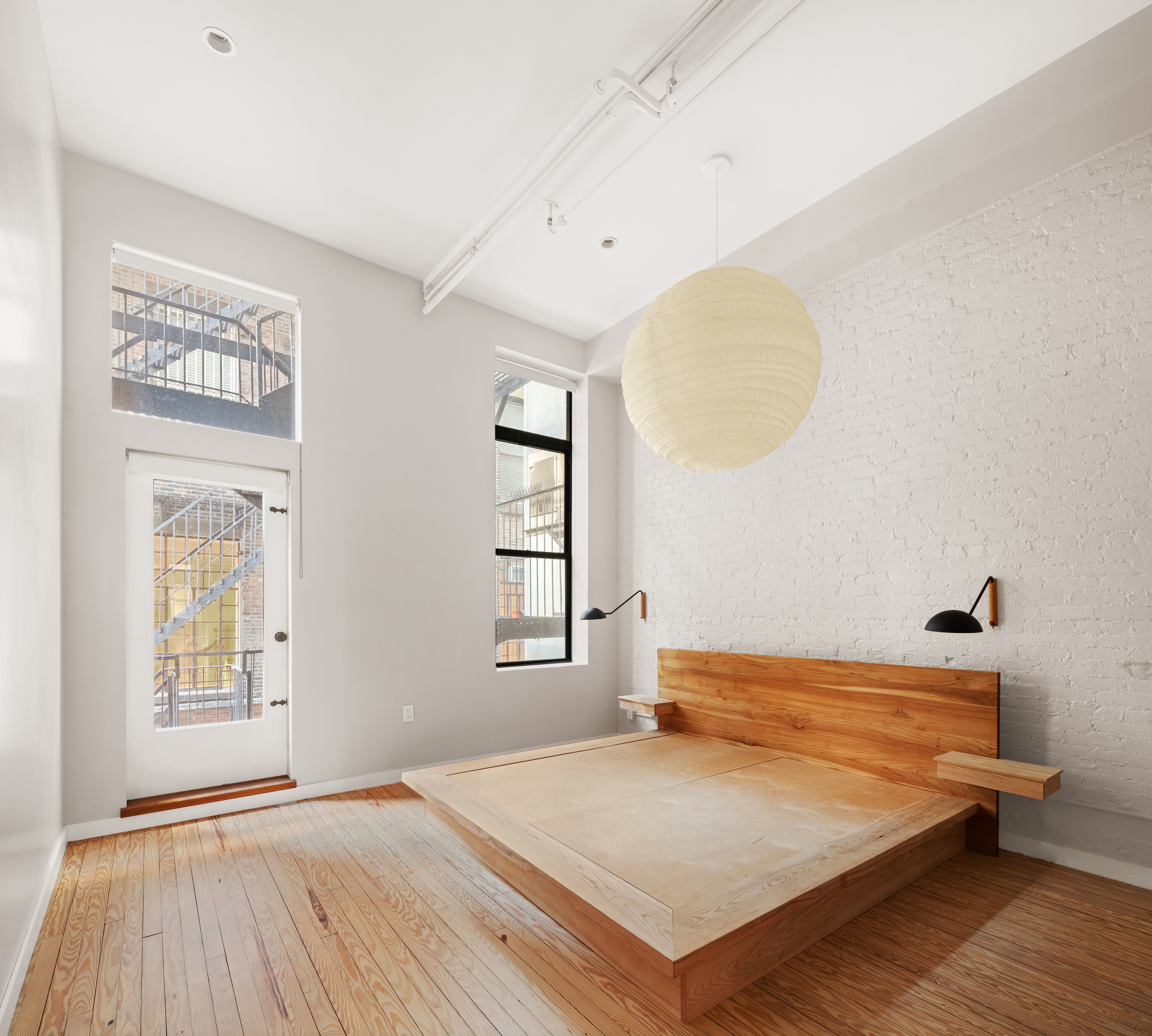 169 Mercer Street, Unit 2 Manhattan, NY 10012 - Photo 5 of 10 a bedroom with a bed and a window