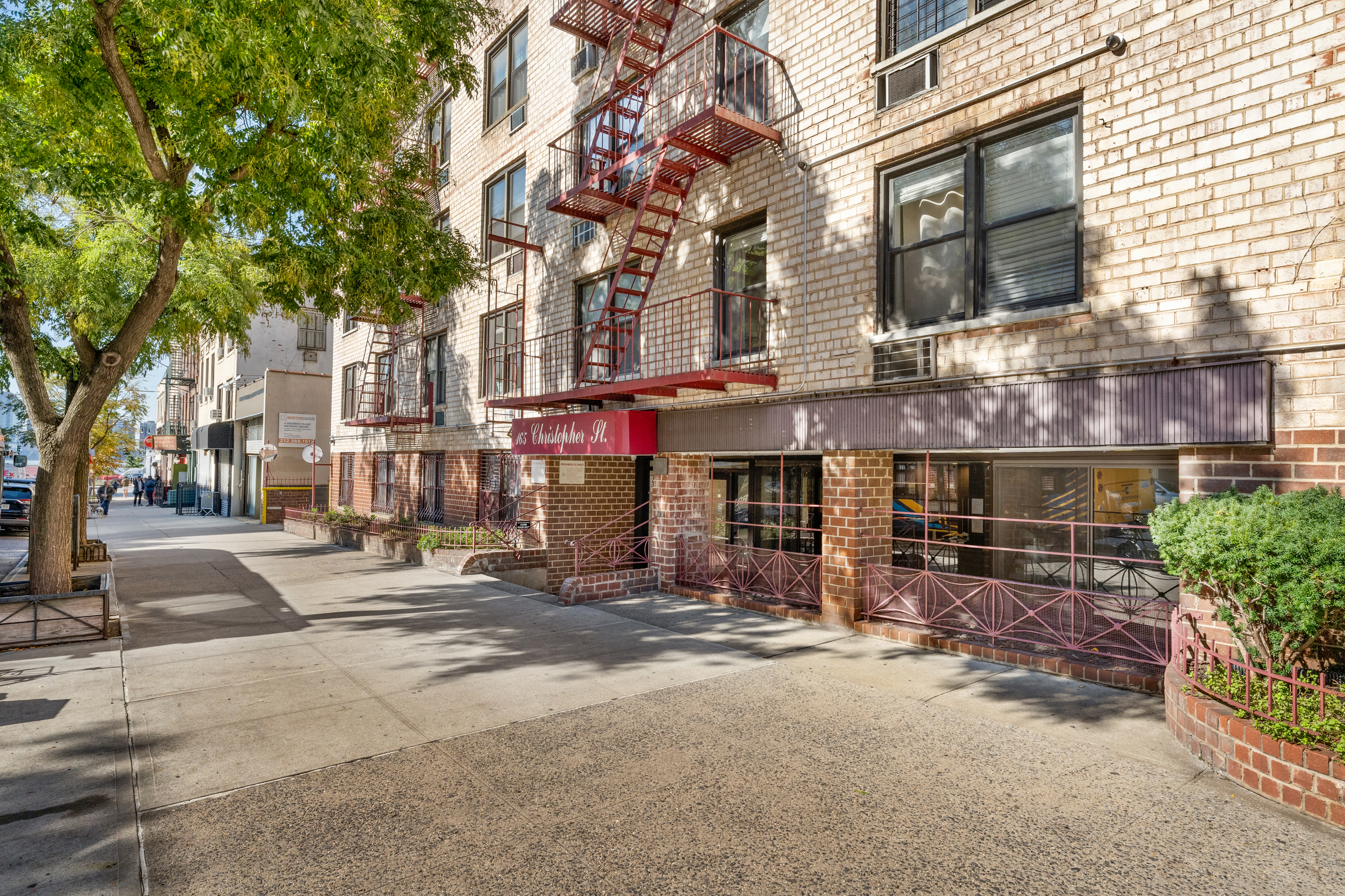 165 Christopher Street, Unit LV Manhattan, NY 10014 - Photo 10 of 16 a view of a street with cars