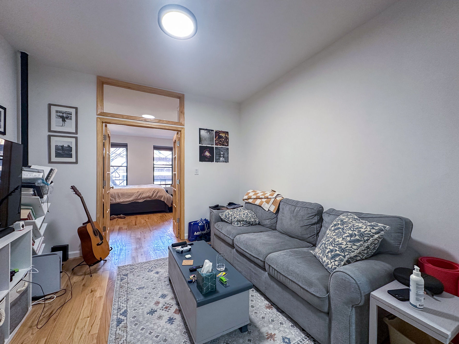 342 East 9th Street, Unit 3B Manhattan, NY 10003 - Photo 1 of 9 a living room with furniture and a couch