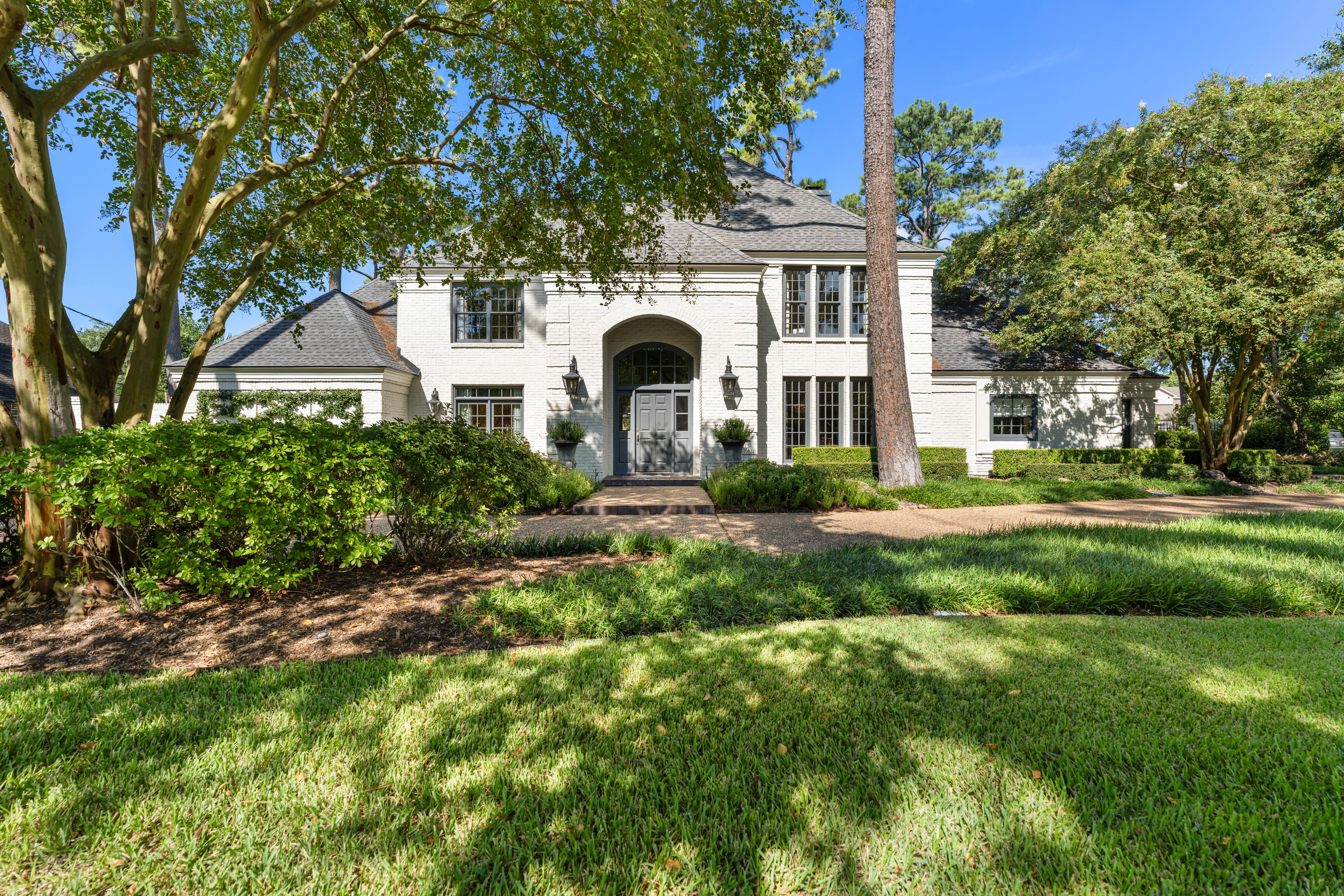 711 Pifer Road Houston, TX 77024 - Photo 6 of 53 a front view of a house with a yard