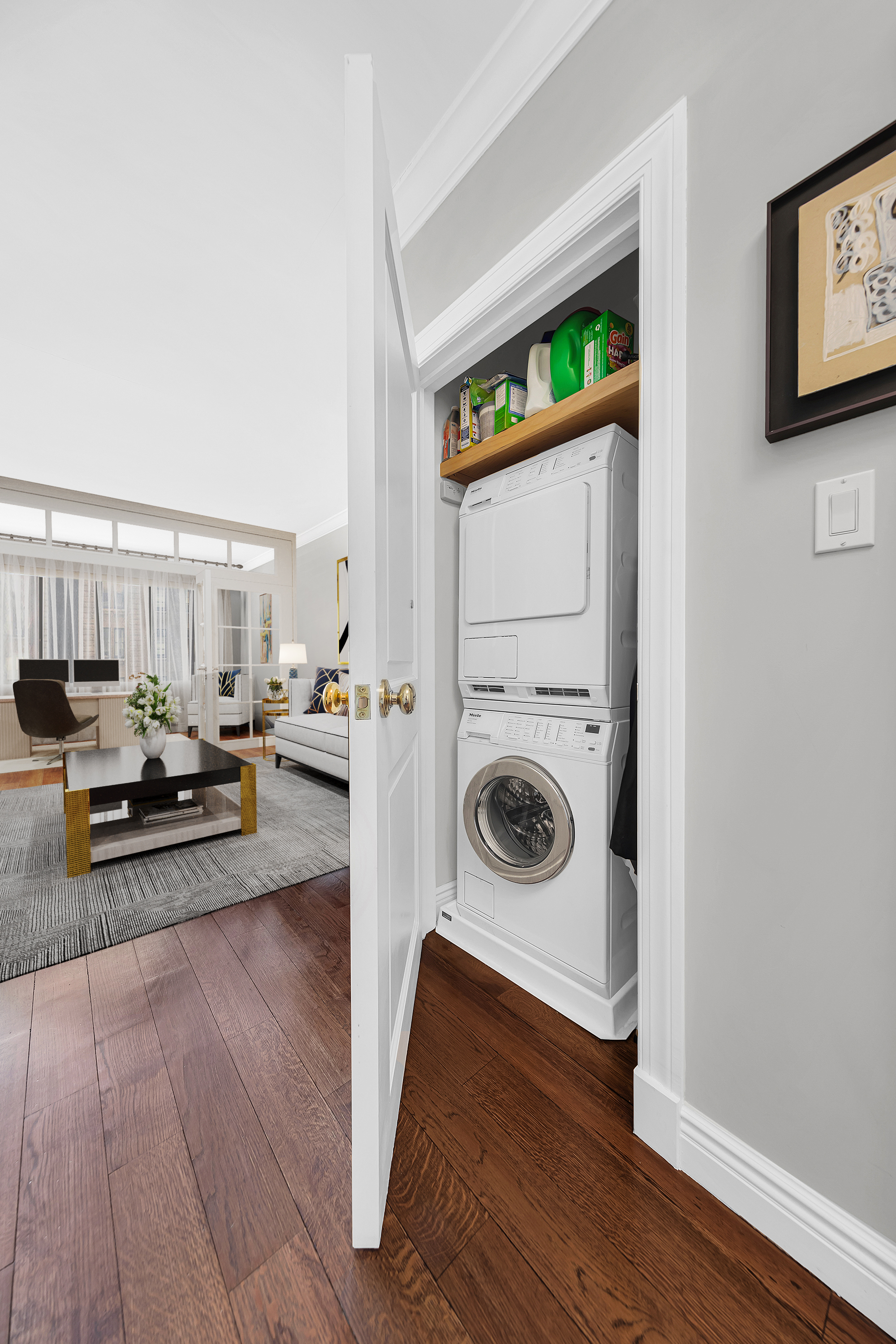 900 Park Avenue, Unit 10B Manhattan, NY 10075 - Photo 5 of 11 a view of living room with furniture and washer dryer