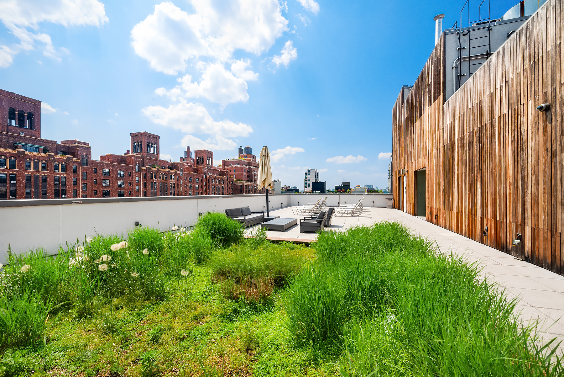420 West 25th Street, Unit 2K Manhattan, NY 10001 - Photo 14 of 18 a view of a garden with a bench and some trees