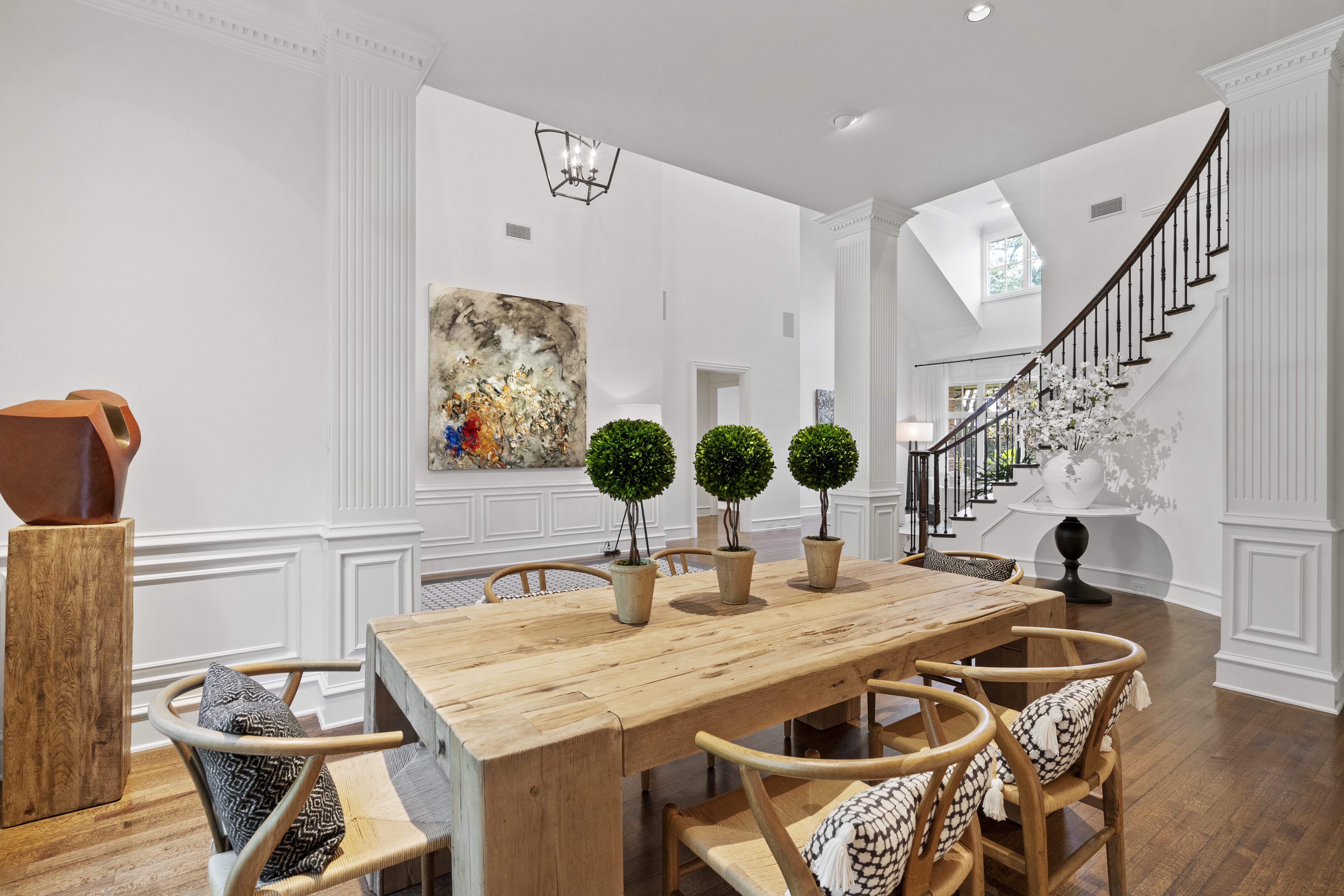 6607 Meadow Road Dallas, TX 75230 - Photo 7 of 32 a view of a dining room with furniture and chandelier