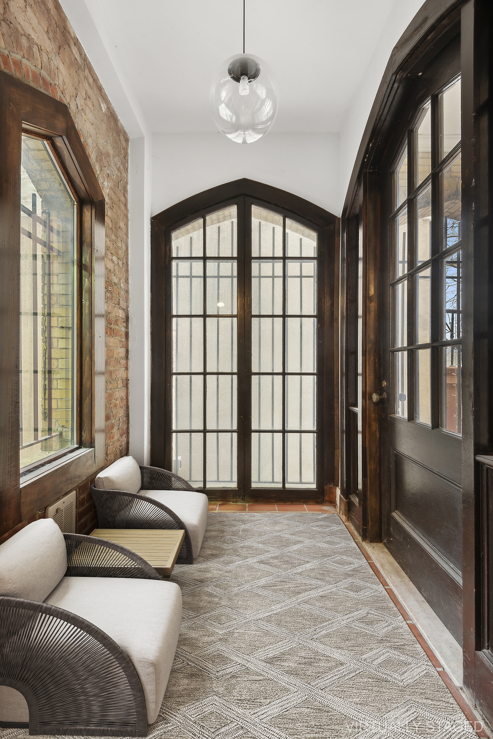 180 Bainbridge Street, Unit 112 Brooklyn, NY 11233 - Photo 5 of 30 a spacious bedroom with a bed and a large window