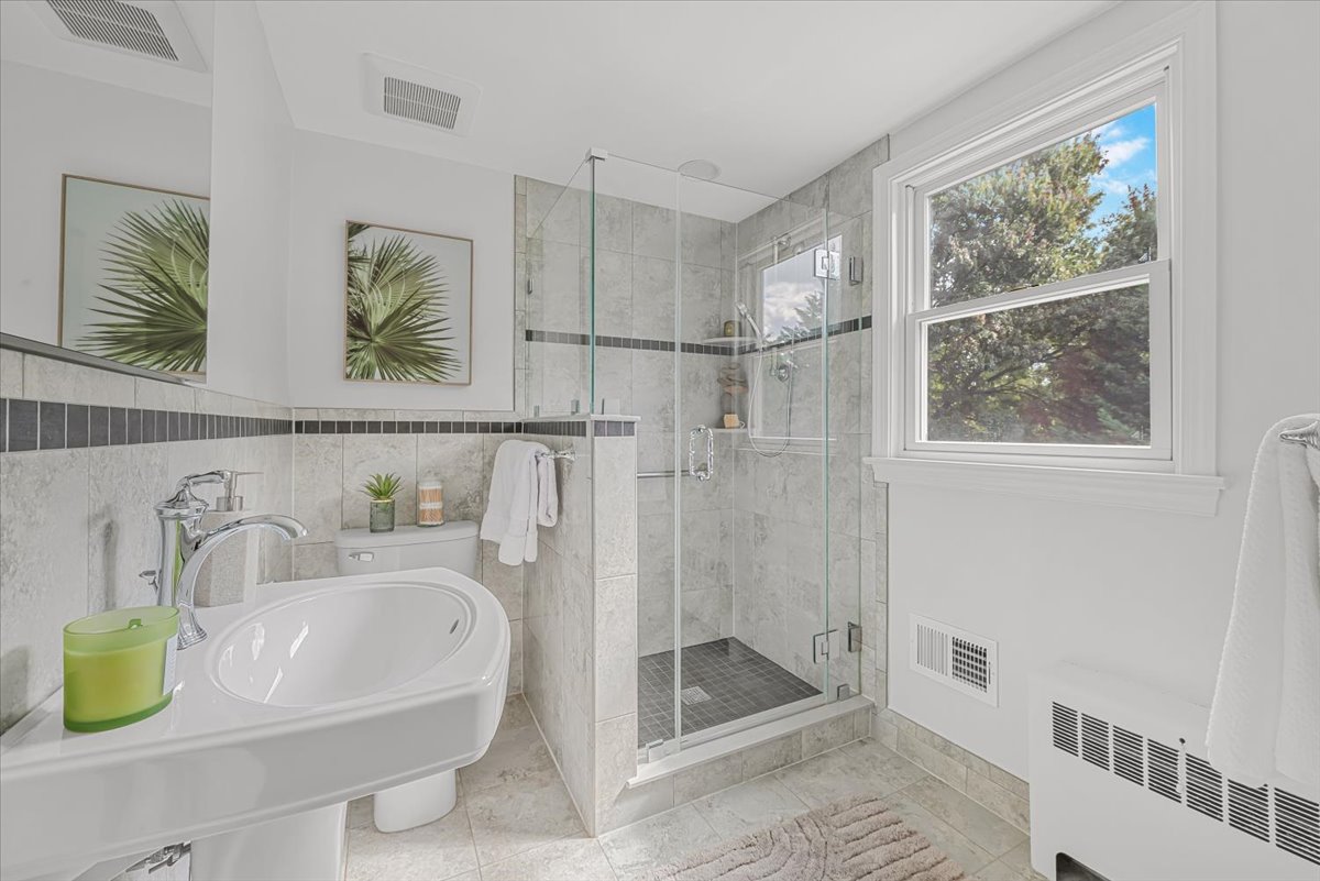 1902 Rookwood Road Silver Spring, MD 20910 - Photo 25 of 36 a bathroom with a sink and a shower