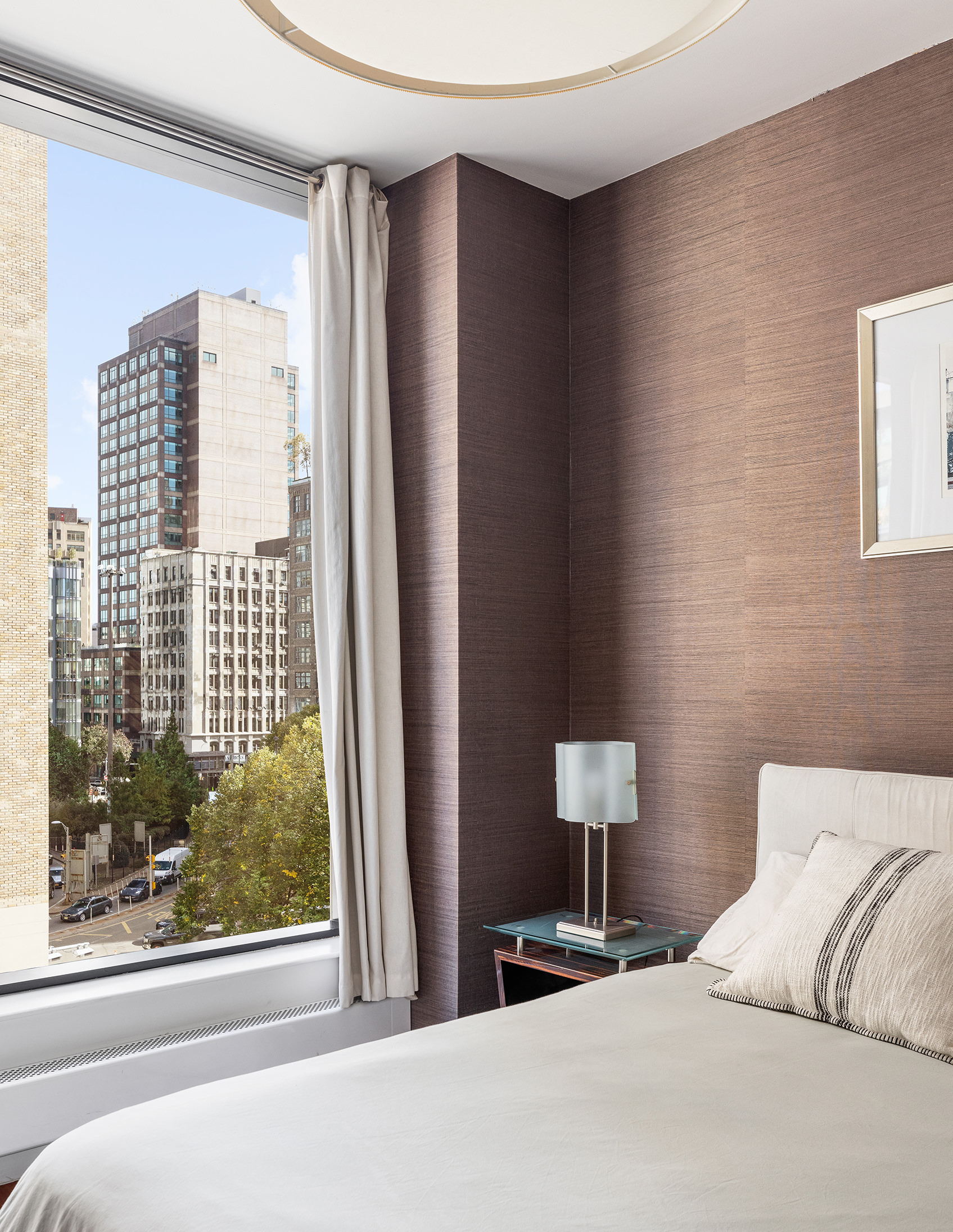 255 Hudson Street, Unit 6F Manhattan, NY 10013 - Photo 5 of 7 a bedroom with a bed and a window