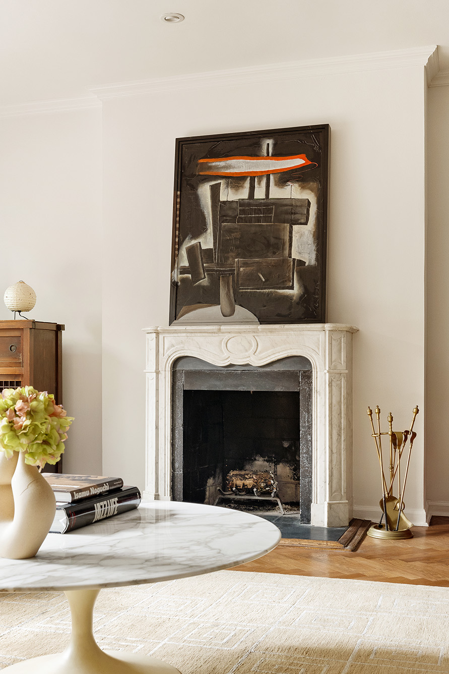 39 East 75th Street, Unit 1E Manhattan, NY 10021 - Photo 4 of 14 a living room with furniture and a fireplace